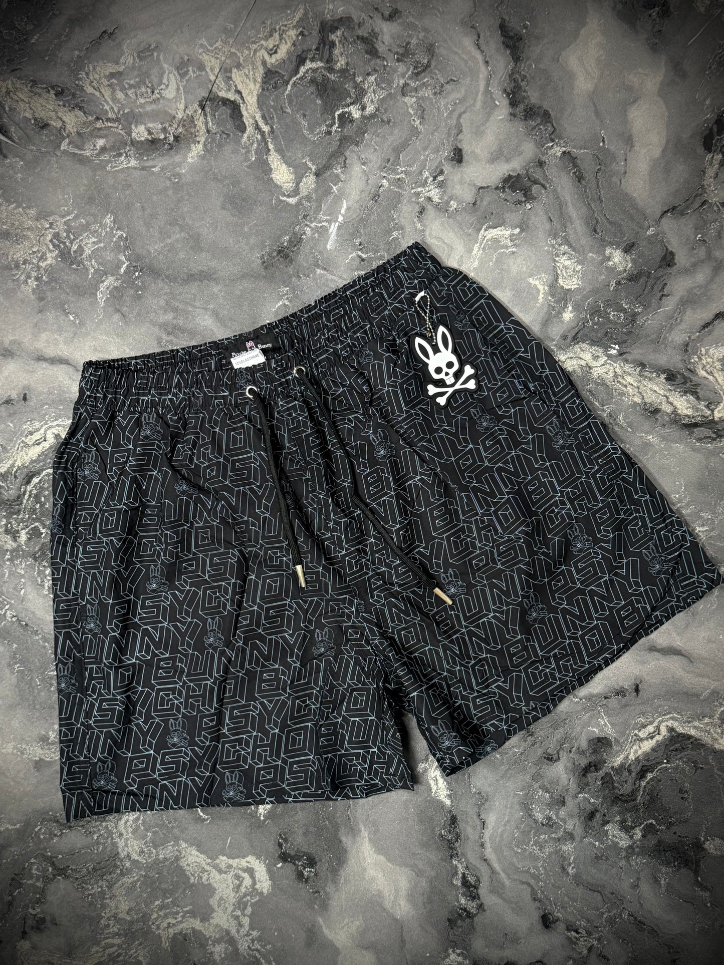 PANTALÓNETA PLAYERA PYSCHO BUNNY NEGRA GRIS