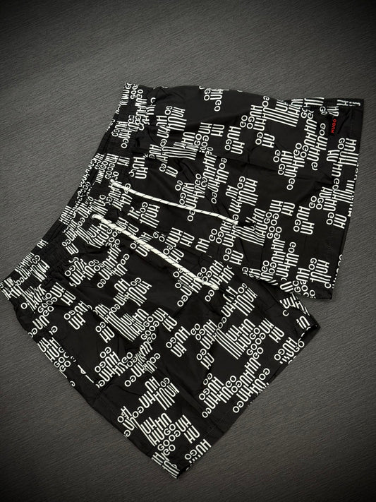 PANTALÓNETA PLAYERA NEGRA MONOGRAMA BLANCO