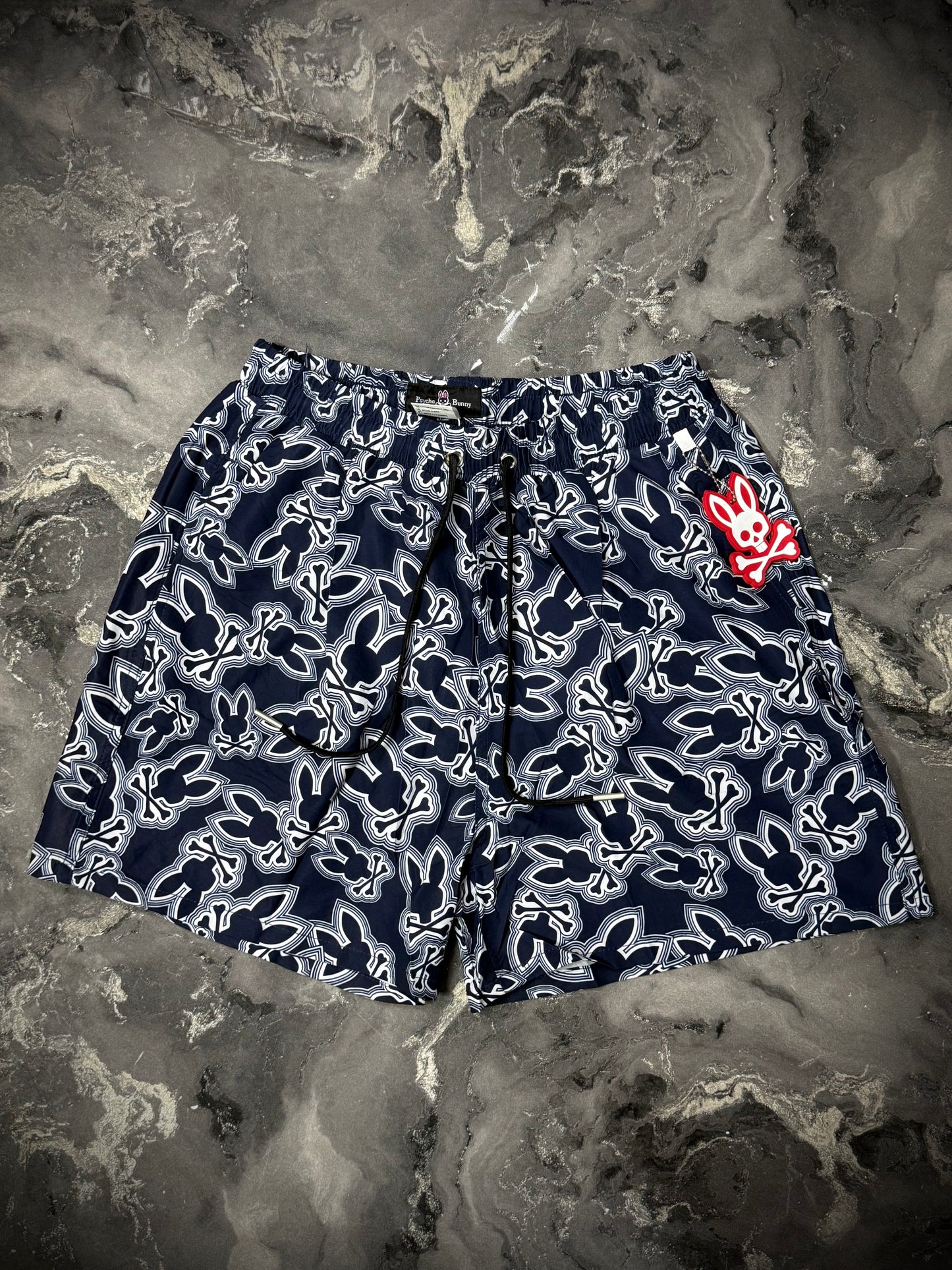PANTALÓNETA PLAYERA PYSCHO BUNNY LOGO AZUL BLANCO