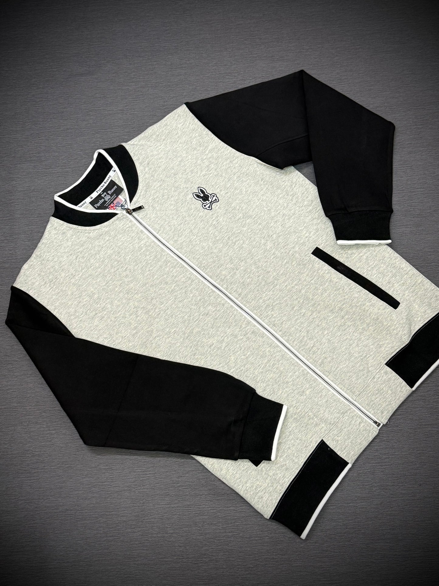 CHAQUETA PYSCHO BUNNY NEGRA GRIS
