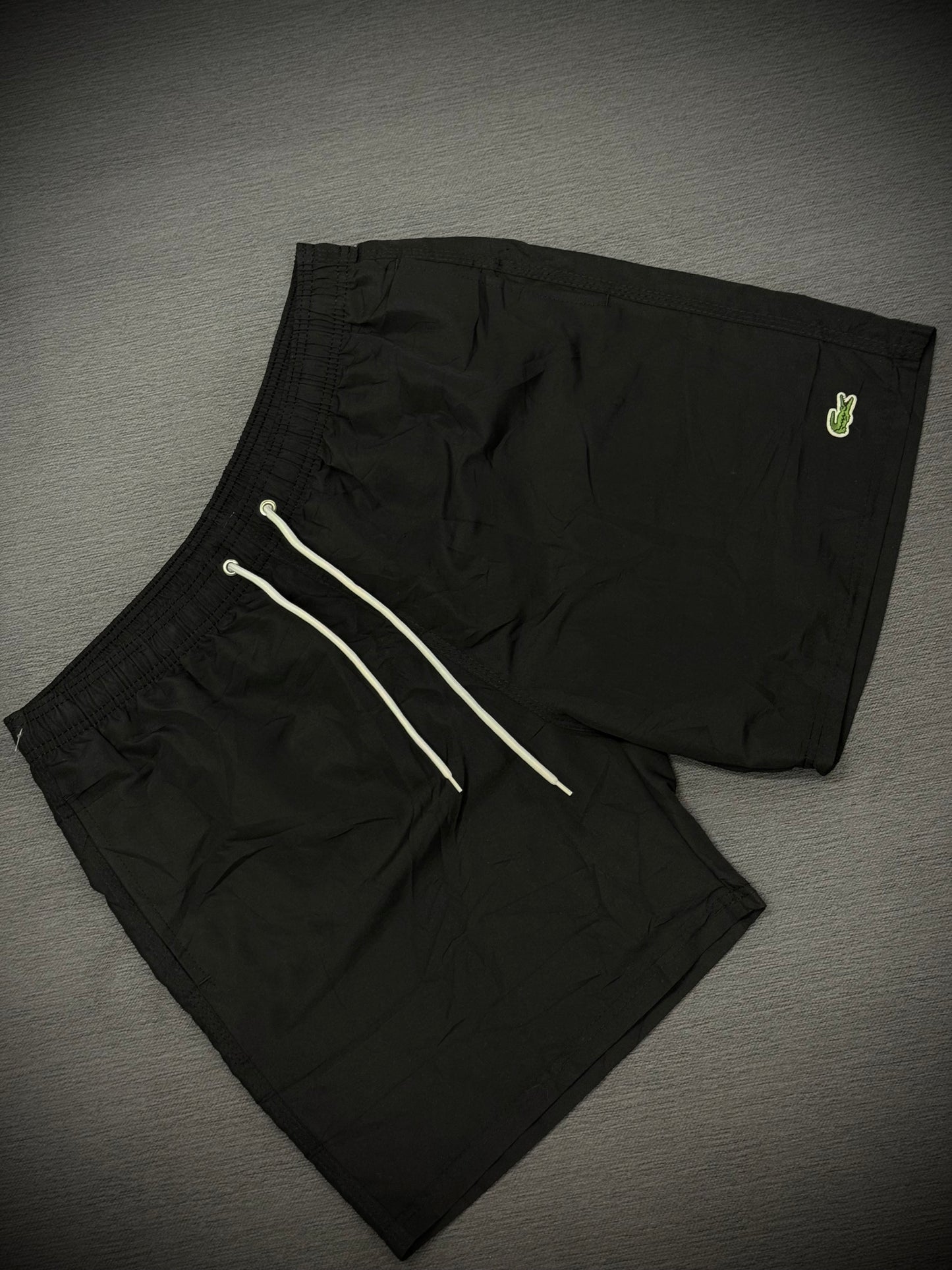 PANTALÓNETA PLAYERA LACOSTE NEGRA LOGO